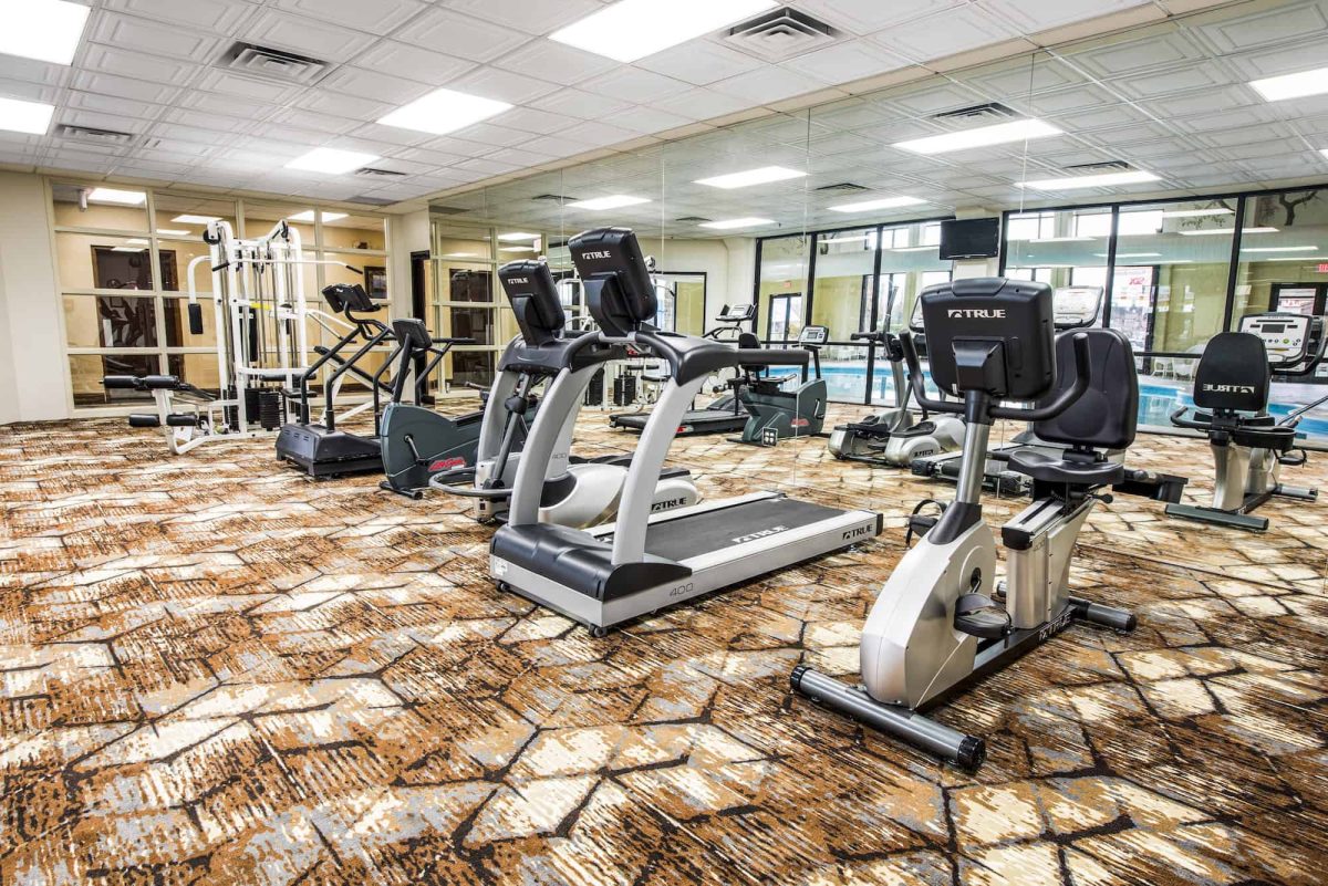 Hotel workout room with various gym equipment