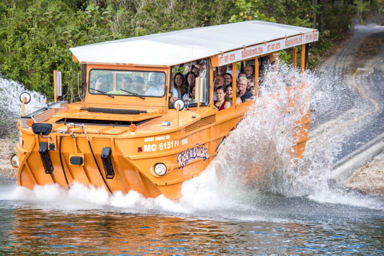 An amphibious vehicle driving into a lake