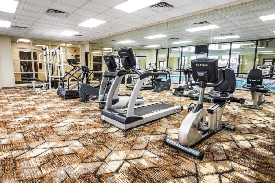 Hotel workout room with various gym equipment